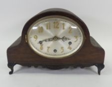 Vintage Napoleon hat style wooden footed mantel clock.
