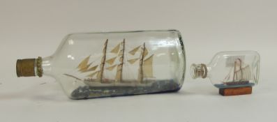Two Decorative Ship in a Bottle. One large, one small. Largest:- 13cm high x 30cm wide.