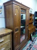 1920s oak wardrobe with single central mirrored door, large drawer to the base and hanging rail