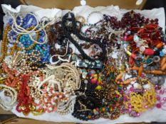 Large quantity of costume jewellery to include large wooden beads, beads and necklaces, synthetic