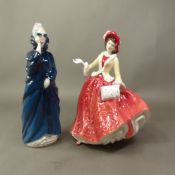Two Royal Doulton figurines, Masque HN2554 and Christmas Day 1999 HN4214 (2).