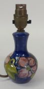 Moorcroft table lamp in the Clematis pattern on a blue ground. (H: 19cm without bulb)