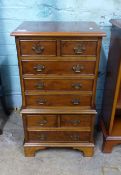 Reproduction yew tallboy in the Georgian style, H 77cm x W 43cm x D 30cm.