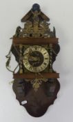 Mid 20th century Dutch Zaanse wall clock with brass weights.