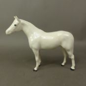 Beswick small thoroughbred stallion painted white model 1992.