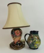 Moorcroft baluster jug in the Hypericum (second), together with table lamp in the Oberon pattern. (