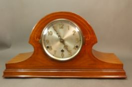 Inlaid mahogany mantle clock, silvered dial with Arabic numerals, key present, width 47cm.