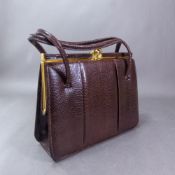 Vintage and unused Golden Arrow lizard skin handbag.