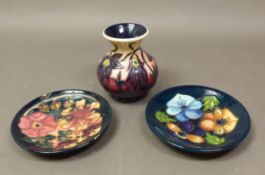 Moorcroft vase in the Pasque Flower pattern, by Philip Gibson (second), together with pin dish in