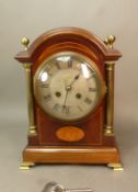 Circa 1900 inlaid mahogany French bracket clock, silvered dial with Roman numerals, key and pendulum