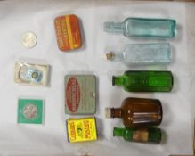 A mixed collection of Pharmacy bottles together with vintage tins, Colman's Mustard, Sure Shield