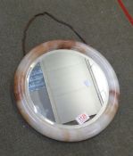 Vintage circular bevel edged mirror in an onyx frame, diameter 36cm.