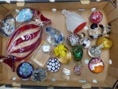A collection of glass paperweights, crystal figures, etc, including a small Guinness paperweight and