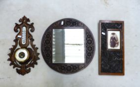 A collection of antique carved wood items, a Belgian wall hanging barometer, a bevel edged mirror in