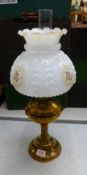 Brass oil lamp with glass chimney and painted ornate glass shade, overall height 55.5cm.