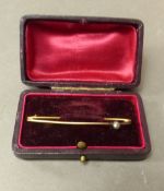 Antique yellow metal brooch (tests as 9ct gold), in safety pin form, set with a single stone, length