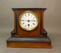 Antique French bedroom clock in walnut case, pendulum and key present, some handwritten service