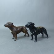 Two Beswick models of Staffordshire Bull terriers, modelled by Arthur Gredington, in brindle gloss