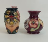 Moorcroft vases, one in the Oberon pattern, and the other in the Pansy pattern on burgundy, both