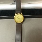 A gentleman's Omega De Ville quartz 1377 wristwatch the circular brushed effect, gold coloured