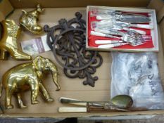 Mixed collection of items to include brass figures, a Spanish style cast metal pot holder, boxed