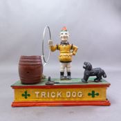 Vintage cast iron trick dog money bank, length 21cm.