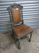 Victorian Gothic Revival chair with leather seating pads.