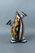 Lorna Bailey footed vase decorated in black, orange and yellow on a white ground, signed, height