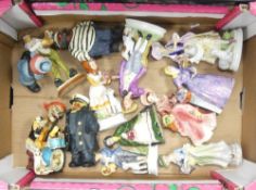 A collection of ceramic foreign lady figurines together with 'Skeleton Rockband' resign figure set