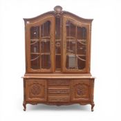 Large French oak Louis XV style display cabinet. Heavily carved details, 3 central drawers, 2