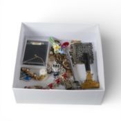 A small collection of vintage costume jewellery and miniature items.