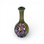 Moorcroft table lamp base in the Clematis pattern on green ground, ceramic part only, height 22cm.