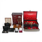 A large collection of costume jewellery comprising jewellery boxes including necklaces, rings,