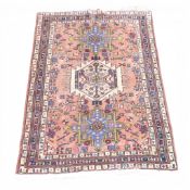 100% Wool Pile rug with recurring abstract pattern of cream, pink, green and light blue. (L: 145cm x