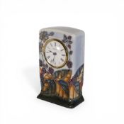 Moorcroft mantel clock in the Blackberry pattern (second). (H: 16cm)