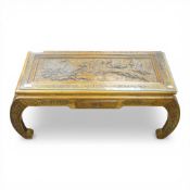 Chinese low coffee table featuring intricate hand-carved panels depicting scenes with birds and