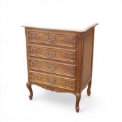 French style oak chest of 4 drawers. Heavily carved with brass hardware on cabriole legs. H82cm x