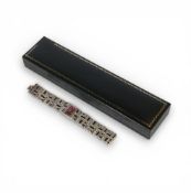 Ladies Silver designer wristwatch, the bracelet set with dark red/brown stones,58.6g.