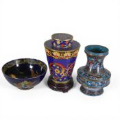 Decorative Oriental cloisonné ginger jar with lid and presented on a wooden base, vintage Oriental