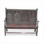 Dark oak 4 panel carved settle on stretcher base H108cm x W134cm