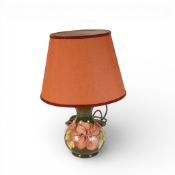 Moorcroft table lamp in the Hibiscus pattern on green ground, height to top of ceramic 16.5cm.