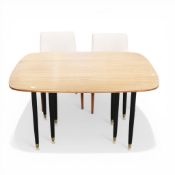 G-Plan E-Gomme Librenza drop leaf teak dining table on turned ebonized legs with brass feet,