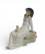Rex Valencia porcelain figurine of a girl sitting on a rock with a dog. (H: 24cm)