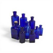 A collection of vintage 'Bristol Blue' poison bottles, with 'Not To Be Taken' embossed on the