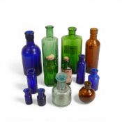 A collection of vintage scientific, medicine and poison bottles, with 'Not To Be Taken' embossed