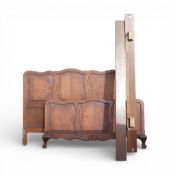 Antique French Louis XV style carved oak double bed frame, featuring rococo serpentine forms and