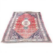 Medium Sized 100% wool pile rug in a combination of colours, cream, navy, red abstract design. (L:
