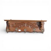 Vintage carved wood wall shelf and coat rack, with ornate brass hooks. (H: 21cm x L: 72cm)