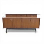 G-Plan E-Gomme Librenza stak sideboard. Ebonised stretcher base on splayed legs. Bifolding double