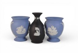 Wedgwood jasperware powder blue vases, together with black bud vase. (H: 22cm) (3)